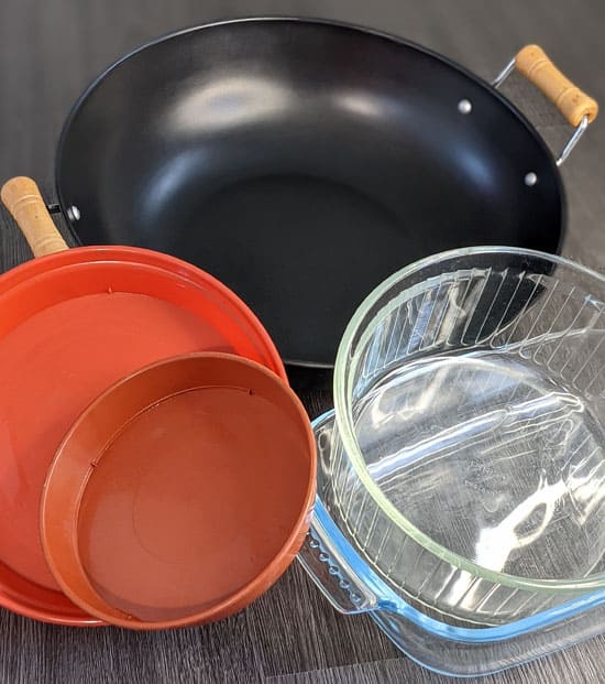 Trays, large pots or bowls all make good watering basins